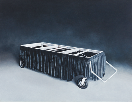 Black draped wheeled cart or platform with a white frame, isolated against a dark studio background.