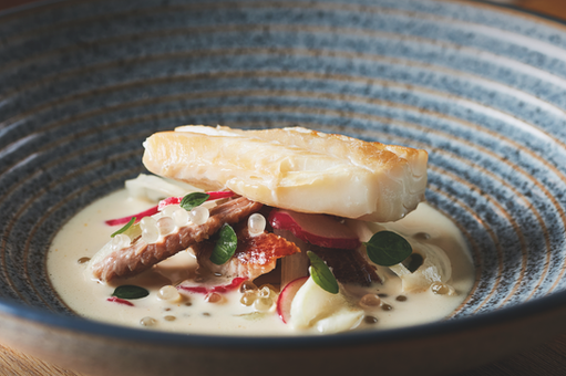 The Plume of Feathers Mitchell historic coaching inn and restaurant near Newquay Cornwall serving modern British pub food using seasonal Cornish ingredients. Traditional Cornish pub restaurant in Mitchell Cornwall offering locally sourced seafood, meat and seasonal produce from the South West. The Plume of Feathers Mitchell award winning country pub with rooms combining historic 16th century coaching inn character with contemporary British cuisine. Restaurant near Newquay and Truro Cornwall serving classic British dishes with creative twists by Head Chef Andrew Dudley. Cornish gastropub dining featuring fresh local fish, ham and eggs, fish and chips and seasonal vegetable dishes inspired by Cornwall’s land and sea. Historic inn with accommodation in Mitchell Cornwall offering boutique rooms, garden dining and relaxed countryside hospitality. Modern British restaurant in Cornwall celebrating regional produce from Cornish farmers, fishermen and artisan suppliers. Country pub restaurant near the A30 in Mitchell Cornwall popular with locals and visitors exploring mid Cornwall and the north coast. Seasonal Cornish menu highlighting seafood, wild garlic, local vegetables and regional meats prepared by experienced chef Andrew Dudley. Boutique pub with rooms in Cornwall combining historic architecture, low oak beams and contemporary dining. Destination pub restaurant in Cornwall near Newquay, Truro and St Austell serving quality British food and local ales. Cornish dining pub experience featuring local beers, craft spirits and wines paired with seasonal menus. Historic Cornish coaching inn offering food, drink and accommodation in a traditional village setting. Modern gastropub cuisine in Cornwall blending home cooking heritage with restaurant quality dishes. The Plume of Feathers Mitchell Cornwall known for classic pub favourites, creative desserts and locally sourced ingredients.