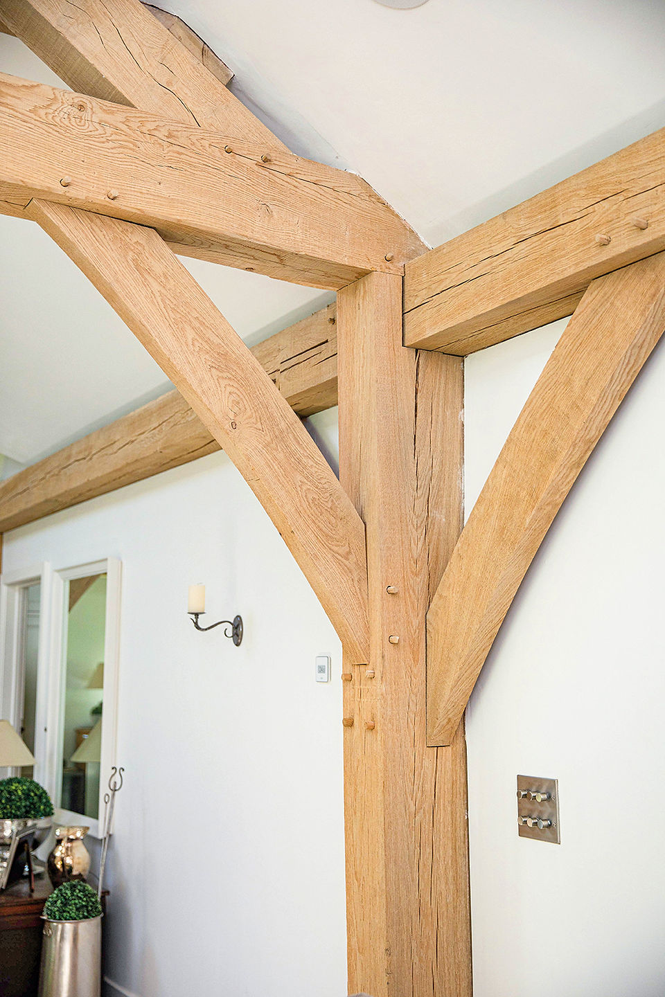 oak frame construction in Cornwall by Post & Beam creating traditional timber framed buildings and homes. Bespoke oak framed houses designed and crafted by Post & Beam in north Cornwall. Traditional timber framing carpentry techniques used to build sustainable oak structures in Cornwall. Handcrafted oak frame architecture combining heritage carpentry with contemporary design in Cornwall. Custom timber frame buildings designed for homes, extensions and commercial projects in Cornwall. Oak frame construction workshop overlooking the north Cornwall coast crafting bespoke timber structures. Traditional mortise and tenon oak joinery used in timber frame homes built by Post & Beam Cornwall. Sustainable oak frame building using responsibly sourced timber and woodland regeneration in Cornwall. Bespoke timber frame extensions and oak framed garden buildings designed in Cornwall. Contemporary timber and steel hybrid frame architecture built by Post & Beam Cornwall. Structural oak carpentry and custom timber framing for residential and commercial buildings in Cornwall. Handcrafted timber frame construction inspired by historic British carpentry traditions. Oak framed architecture used in galleries, inns and community buildings across Cornwall and the Isles of Scilly. Sustainable timber construction using traditional woodworking tools and techniques in Cornwall workshops. Artisan carpentry creating custom oak framed homes and buildings designed to last for generations in Cornwall.