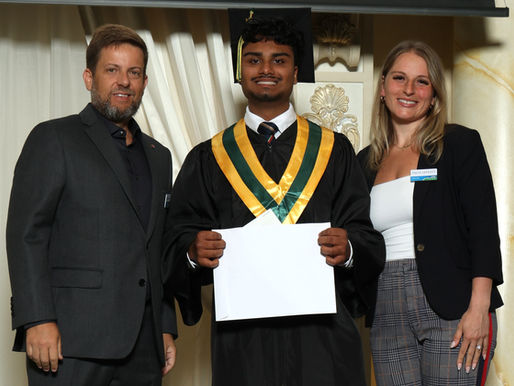 Marcus Narine receiving the 2026 Youth Business Award from King Chamber of Commerce VP Mario Meyer and Chair of Youth Talia Iafrate at King City Secondary School graduation