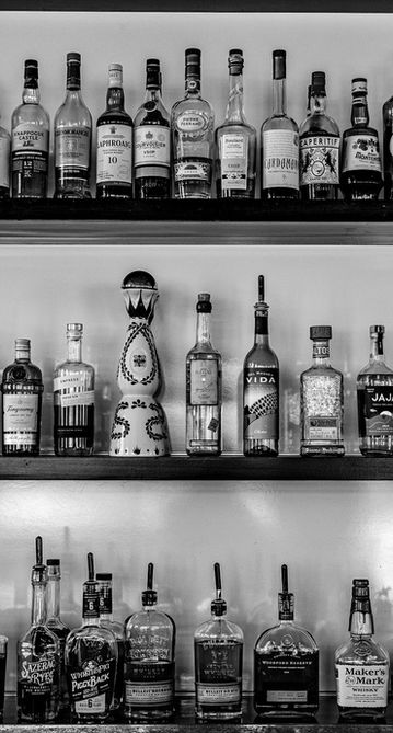 Rows of liquor bottles on shelves