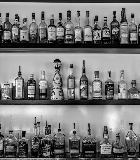 Rows of liquor bottles on shelves