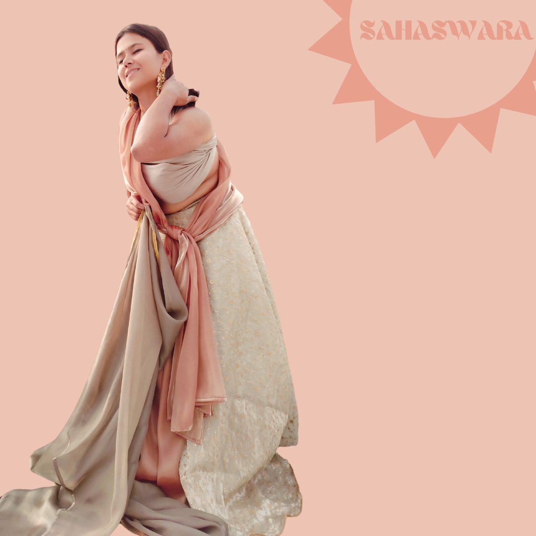 A Grey lehenga embroidered with golden wire, wore by a model