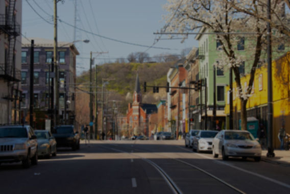 Road in Cincinnati with apartments and cars
