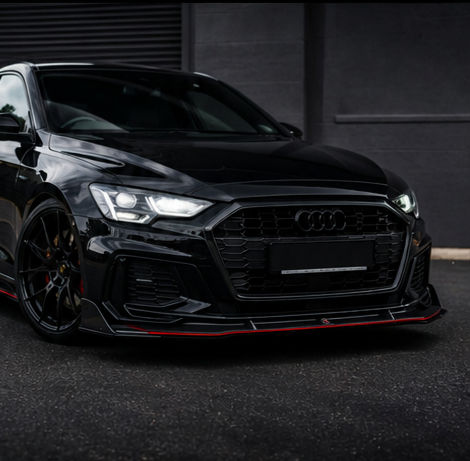 Modified black performance car with exterior styling upgrades