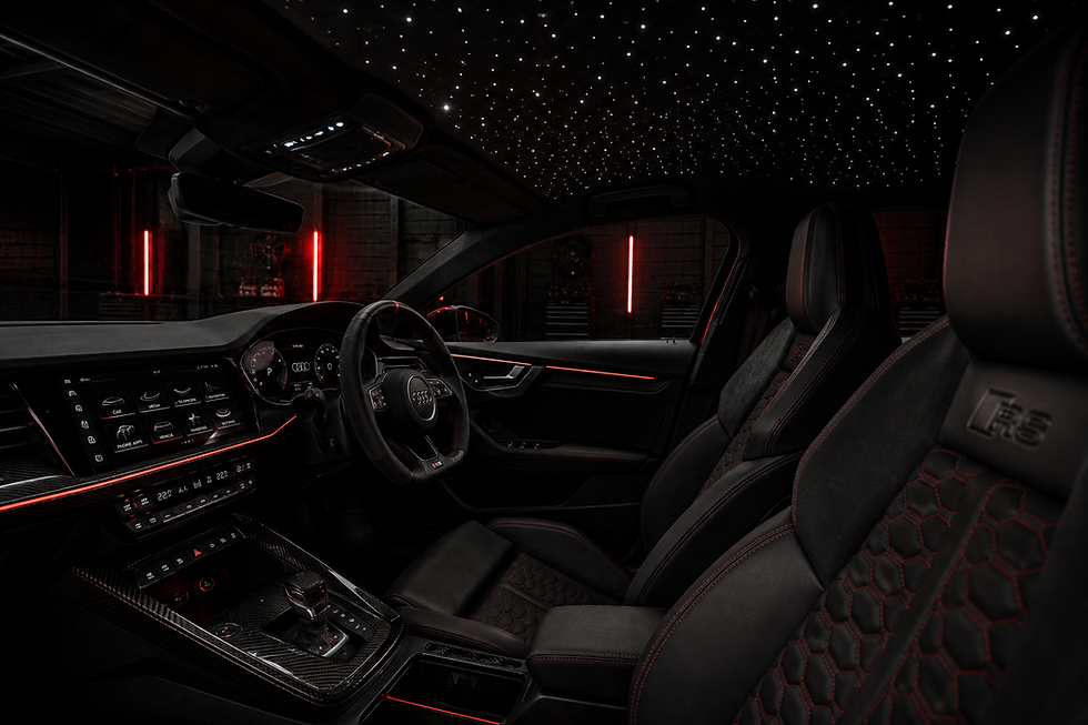 Dark modified performance car in a cinematic workshop setting
