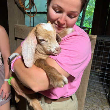 melissa with baby goat.jpeg
