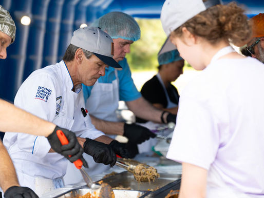 Chefs and volunteers plate up meals
