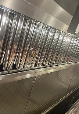 Clean stainless steel hood baffle filters after exchange