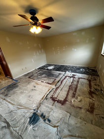 Interior painting surface preparation with floors protected by Colorful Visions® in Racine, Wisconsin