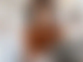 Here is a woman smiling as she works from her laptop. Whatever she is doing looks to be enjoyable. 