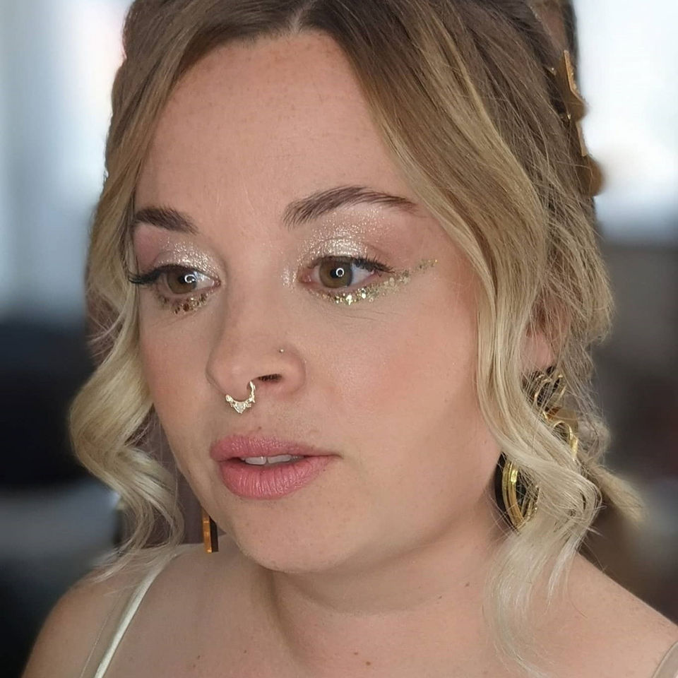 Bridal makeup featuring glowing skin and soft neutral eyes, ideal for a wedding at Rockbeare Devon