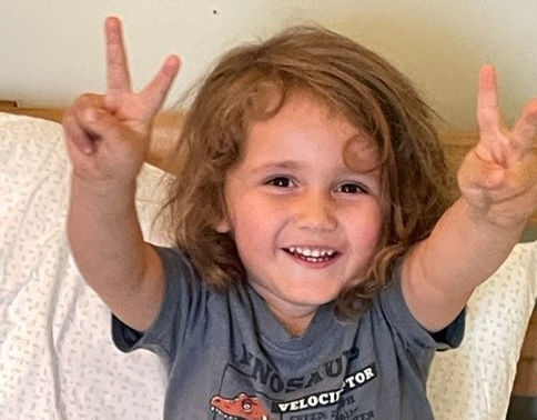 Happy little boy in bed_cropped.jpg