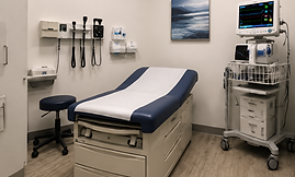 Medical exam room with bed and monitoring equipment
