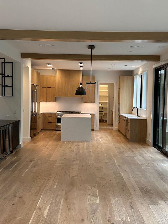 Modern kitchen with wooden cabinets, island, and open-concept design HOME.