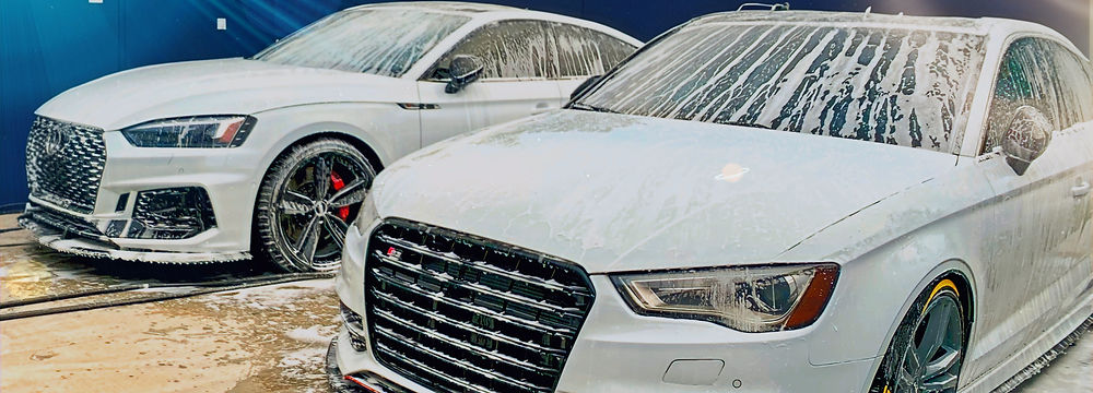 Audi RS5 and Audi S3 covered in soap suds, ready for a Maintenance Wash at Drip Autosalon.