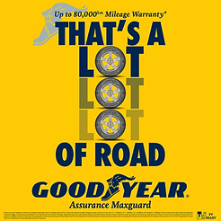 Promotional Goodyear advertisement featuring the headline "THAT'S A LOT LOT LOT OF ROAD", with three tyre images creatively replacing the letter "O" in the word "LOT." At the top, the ad highlights *"Up to 80,000km Mileage Warranty"**. The Goodyear logo appears prominently at the bottom above the product name Assurance MaxGuard, with an EV Ready badge in the lower-right corner. The design uses Goodyear's signature yellow background with bold navy typography, emphasizing durability, long-lasting performance, and mileage warranty. Fine print with warranty terms is displayed along the bottom edge.