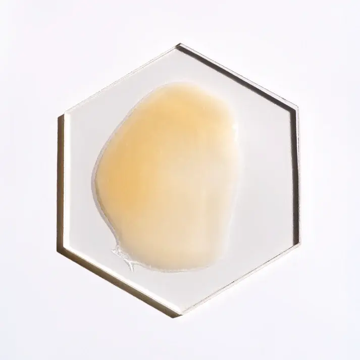 Thumbnail: Close-up of GlowTone Corrective Serum texture showing a smooth, creamy white swatch on a white background.