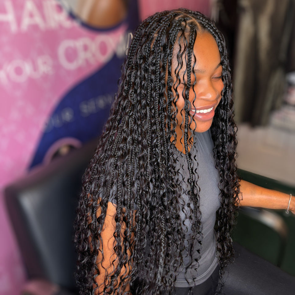 Client with long black boho braids which are waist length styled by Bella Avanti in Slough