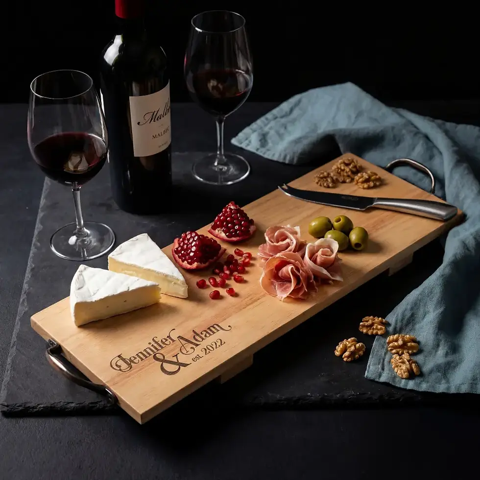 Thumbnail: Luxury personalized wedding gift idea: a long wood serving platter on a dark rustic tabletop.