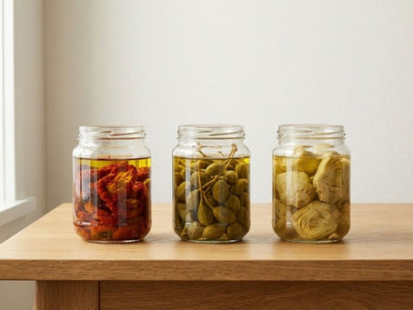 Traditional Mediterranean preserved foods prepared with minimal intervention. Close-up of preserved ingredients maintaining natural texture and color. Glass jars showing restrained preservation without additives.