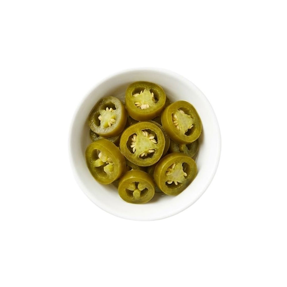 High-resolution image of Pickled Jalapeño Slices in Mediterranean brine, showcasing vibrant green sliced peppers with glossy texture. Presented in a clear jar on a white background, produced under Inbrine.com export standards.