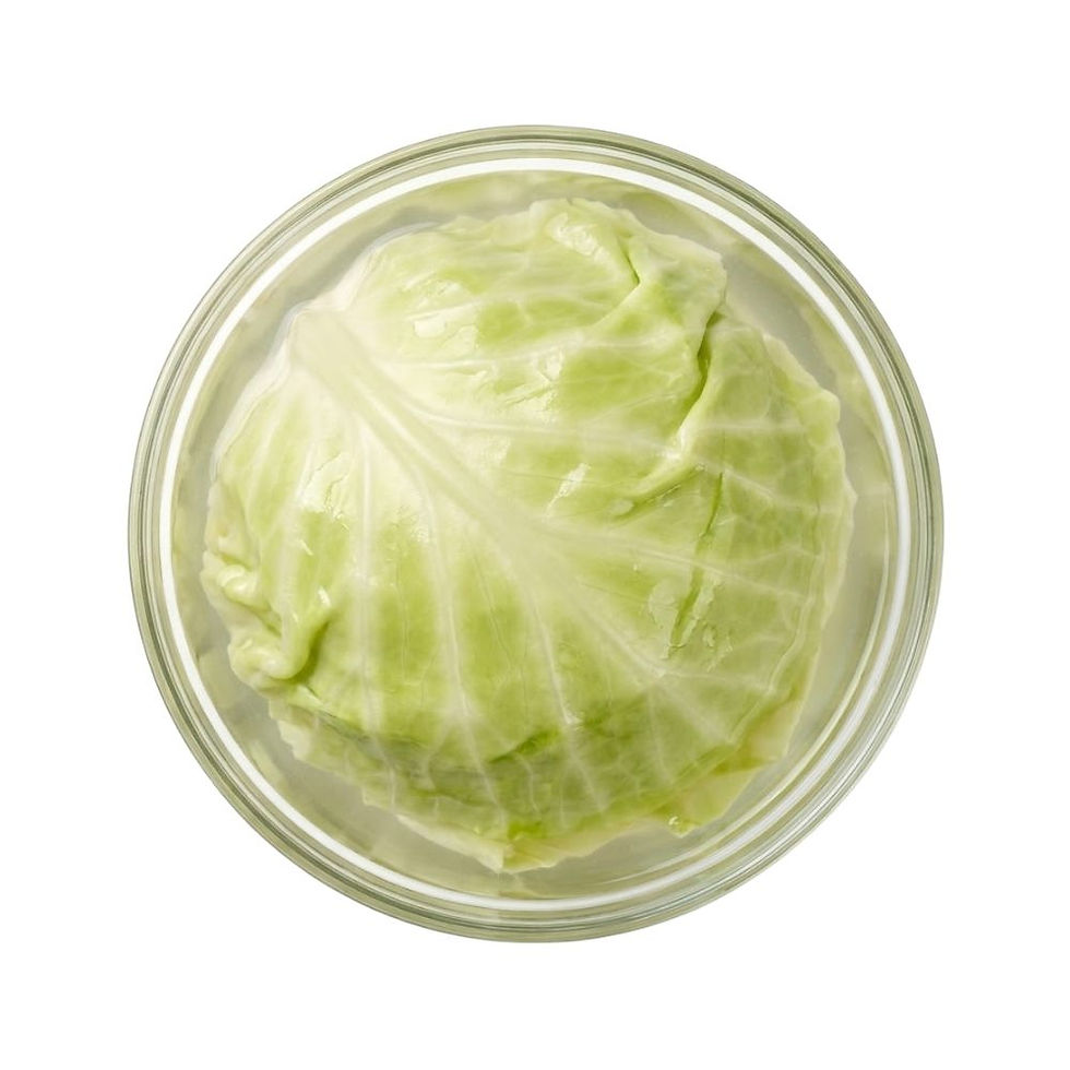 Cabbage Leaves in Brine arranged in a shallow glass bowl, square studio photo on a pure white background.