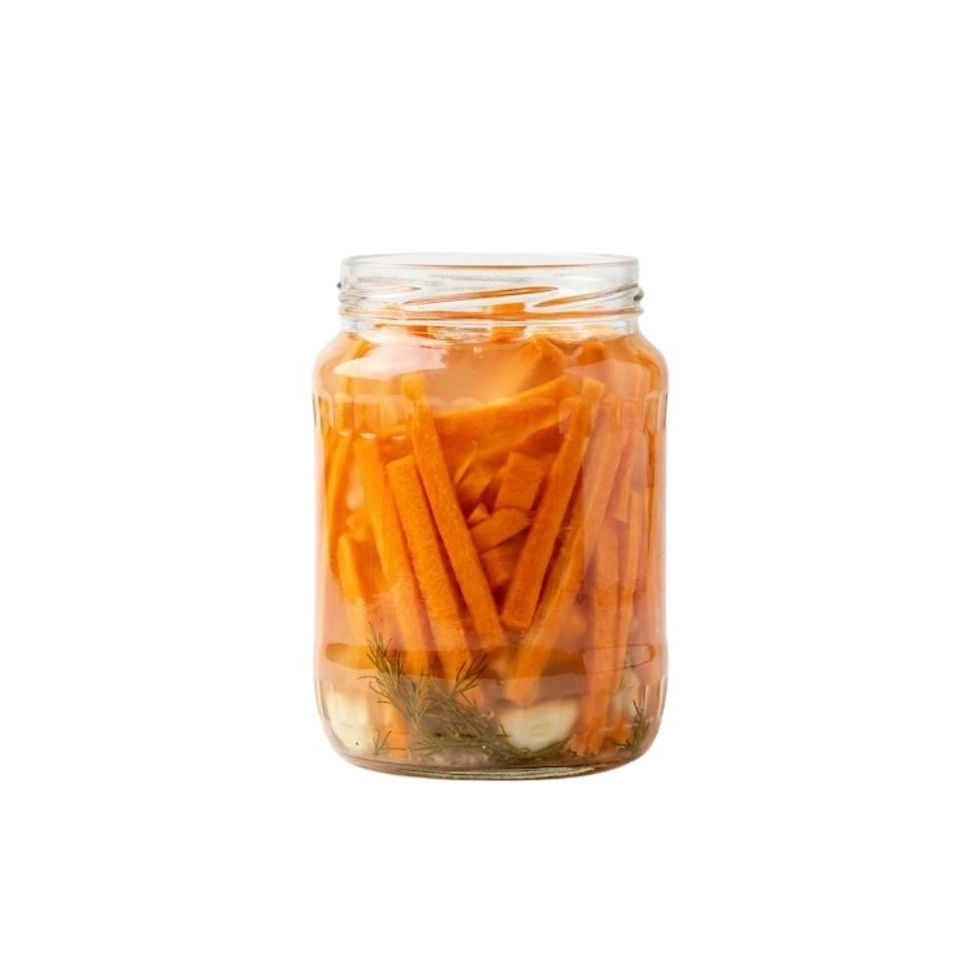 High-resolution image of Fermented Carrot Strips in natural lactic brine, showing bright orange fermented carrot strips with crisp texture. Displayed in a clear jar on a clean white background under Inbrine.com export standards.