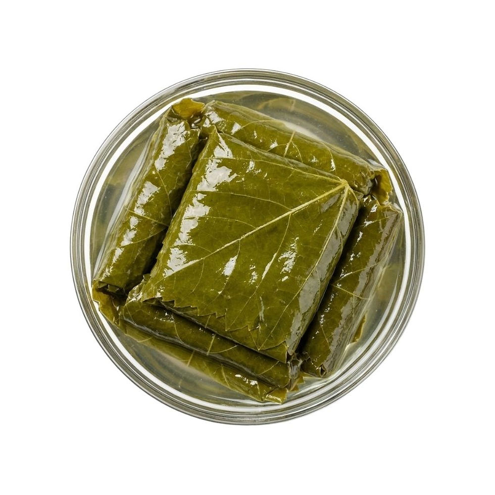 Syrian Baladi Grape Leaves in Brine arranged in a small glass bowl, square studio shot on pure white background.