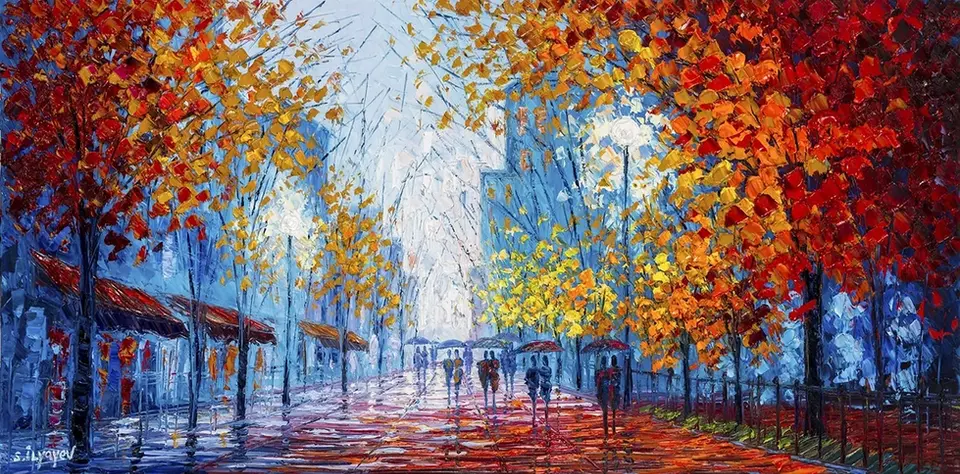 Autumnal street scene, fiery trees and people walking under umbrellas.