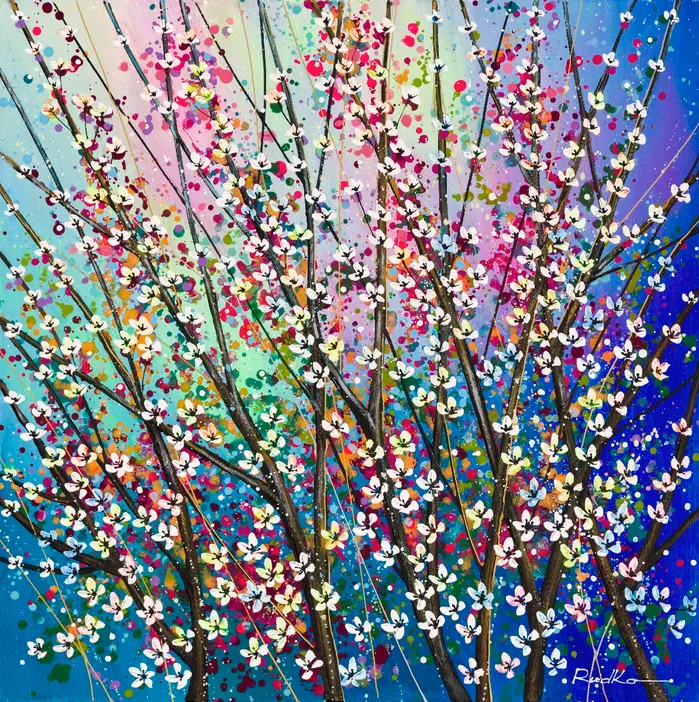 Intertwined branches covered in white petals against a layered, multicolored background.