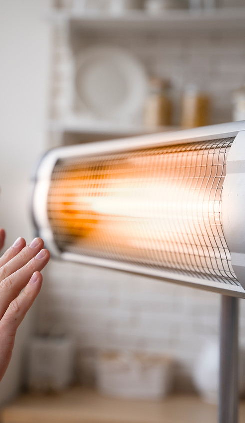 people-warming-up-hands-near-heater.jpg