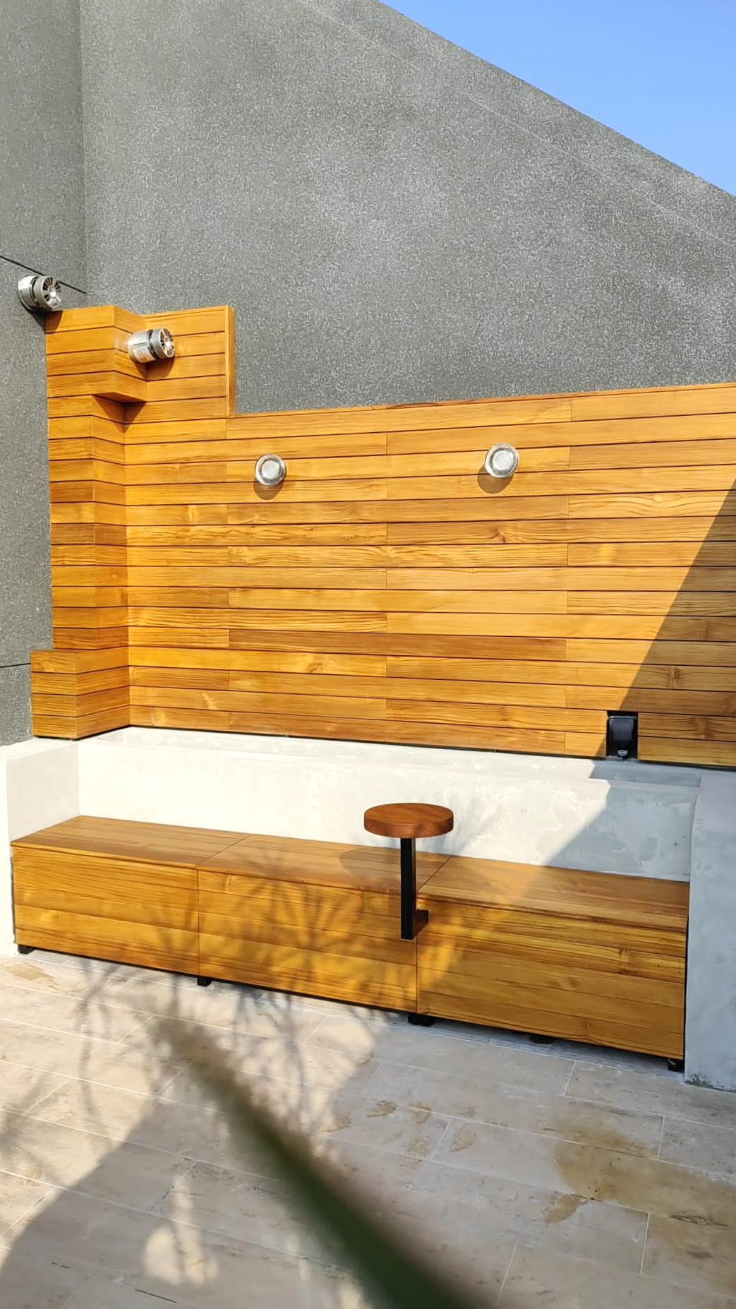 Wood cladding and outdoor bench seating made with Teak