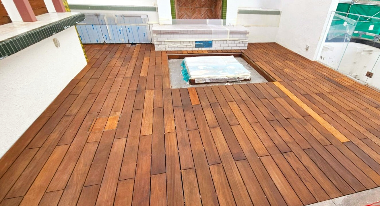 Outdoor Teak solid wood deck flooring in modern Hong Kong residential space, featuring natural hardwood planks with high durability and elegant finish