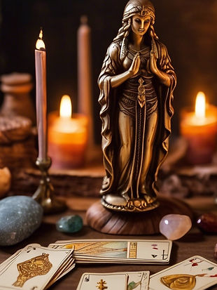 wood table with candle, tarot cards and