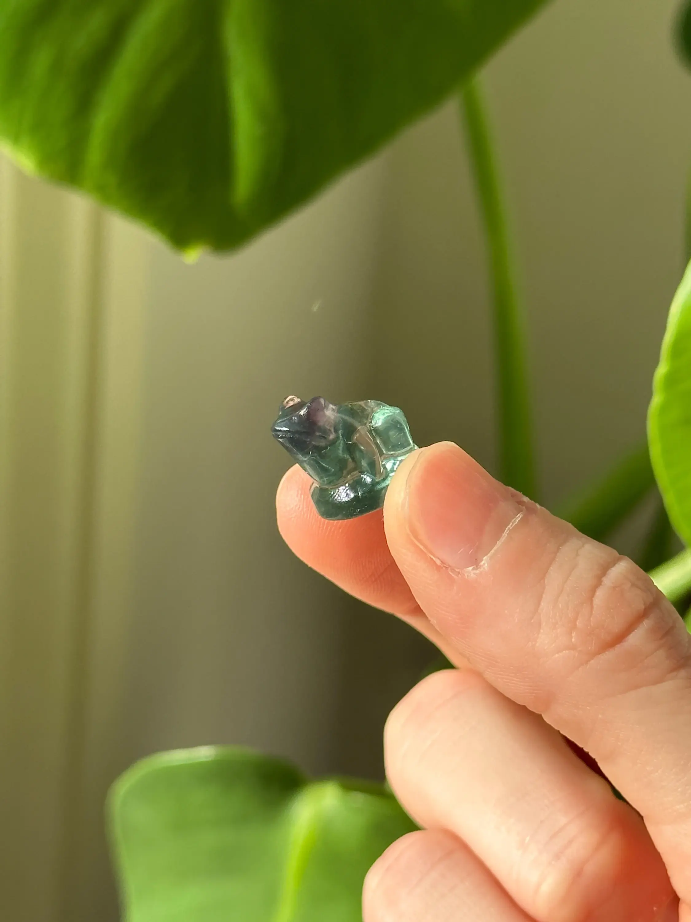 Small green and purple fluorite frog crystal carving
