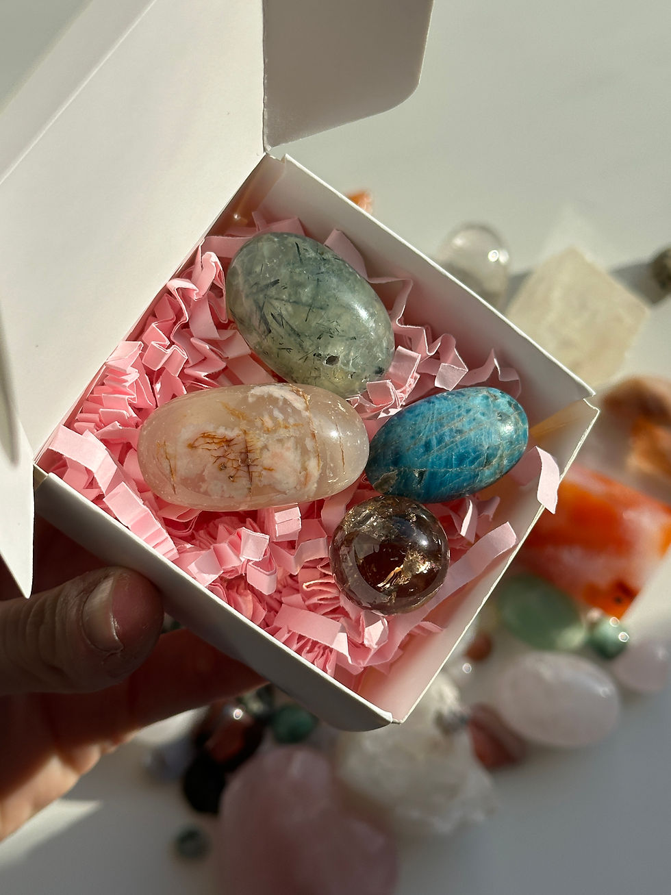 Thumbnail: Crystal mystery gift box with pink tissue wrap and assorted healing stones