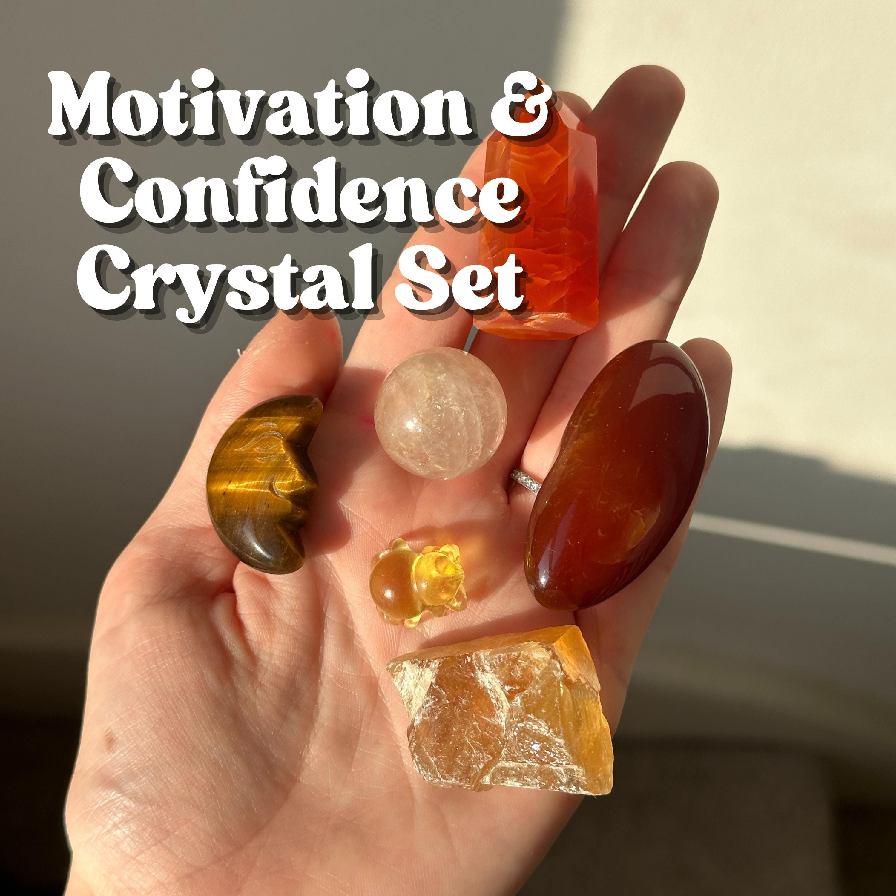 Hand holding a polished Carnelian Tower crystal for motivation and confidence