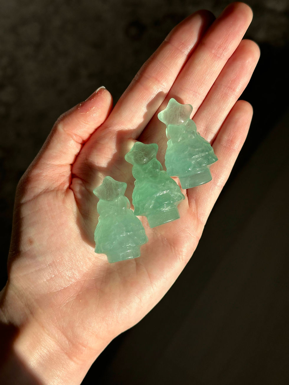 Green fluorite crystal Christmas trees on hand