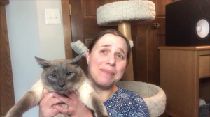 Kate Holding Siamese named Zola