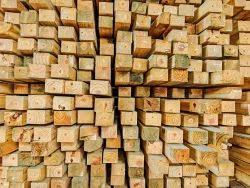 Stacked wooden beams. Texture and pattern of the wood. Pallet Business.