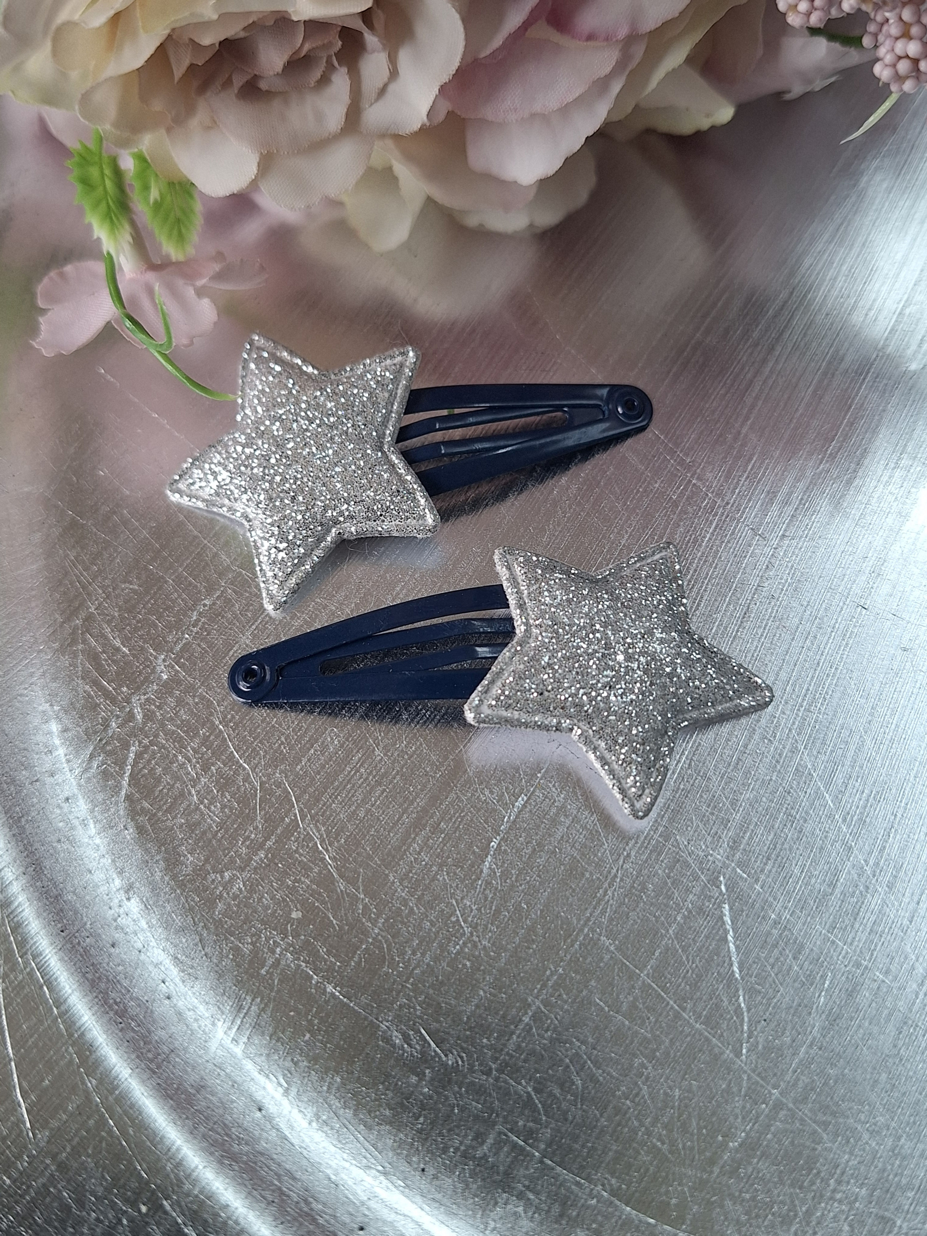 Silver glitter stars on black snap hair-clips