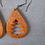 Thumbnail: Handmade orange glitter Christmas tree earrings