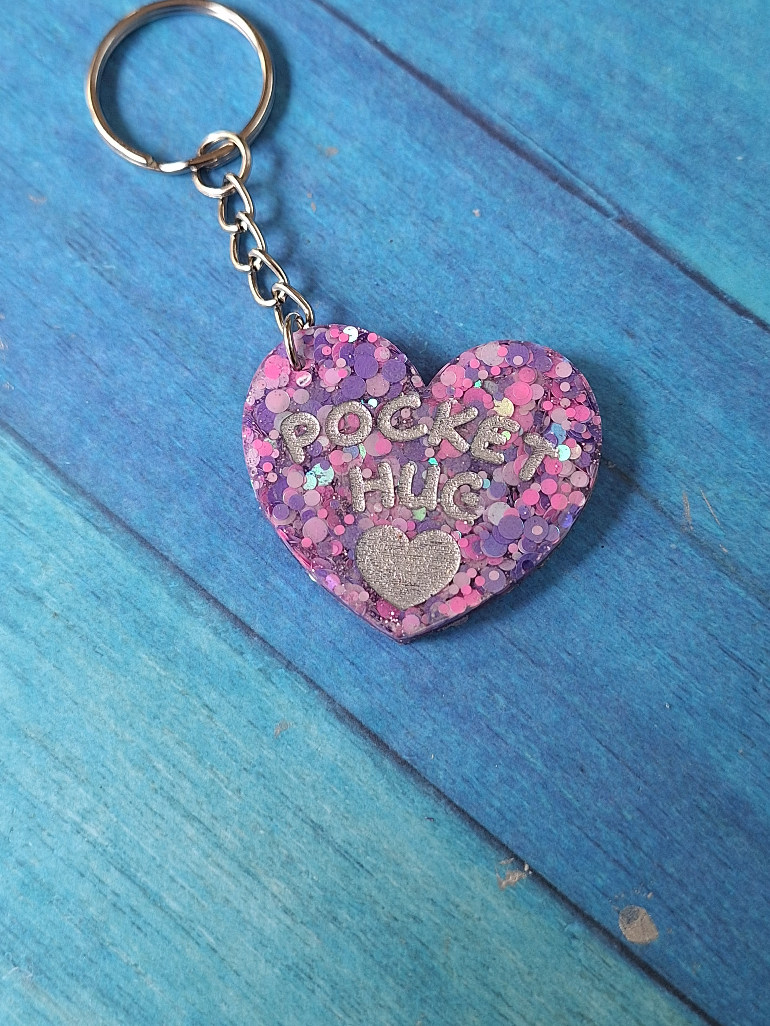 Handmade pink and purple glitter pocket hug.
