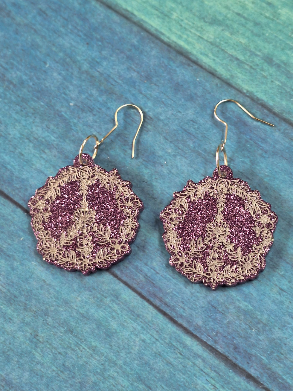 Thumbnail: Handmade  purple glitter floral peace sign earrings on silver plated hoo