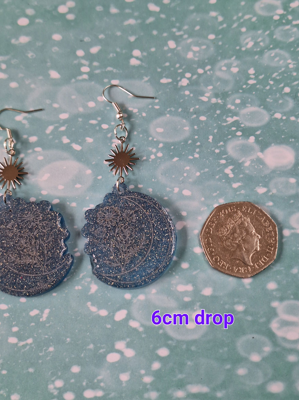 Thumbnail: Handmade blue/silver glitter floral moon earrings on silver plated hoo