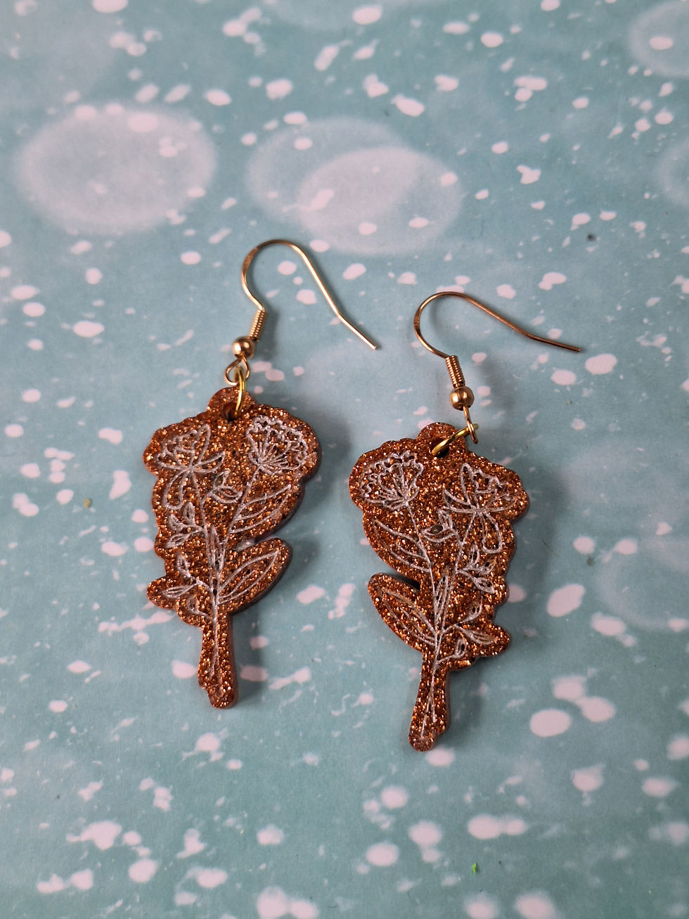 Thumbnail: Handmade bronze flower earrings on silver plated hooks
