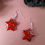 Thumbnail: Handmade red glitter puffy star earrings