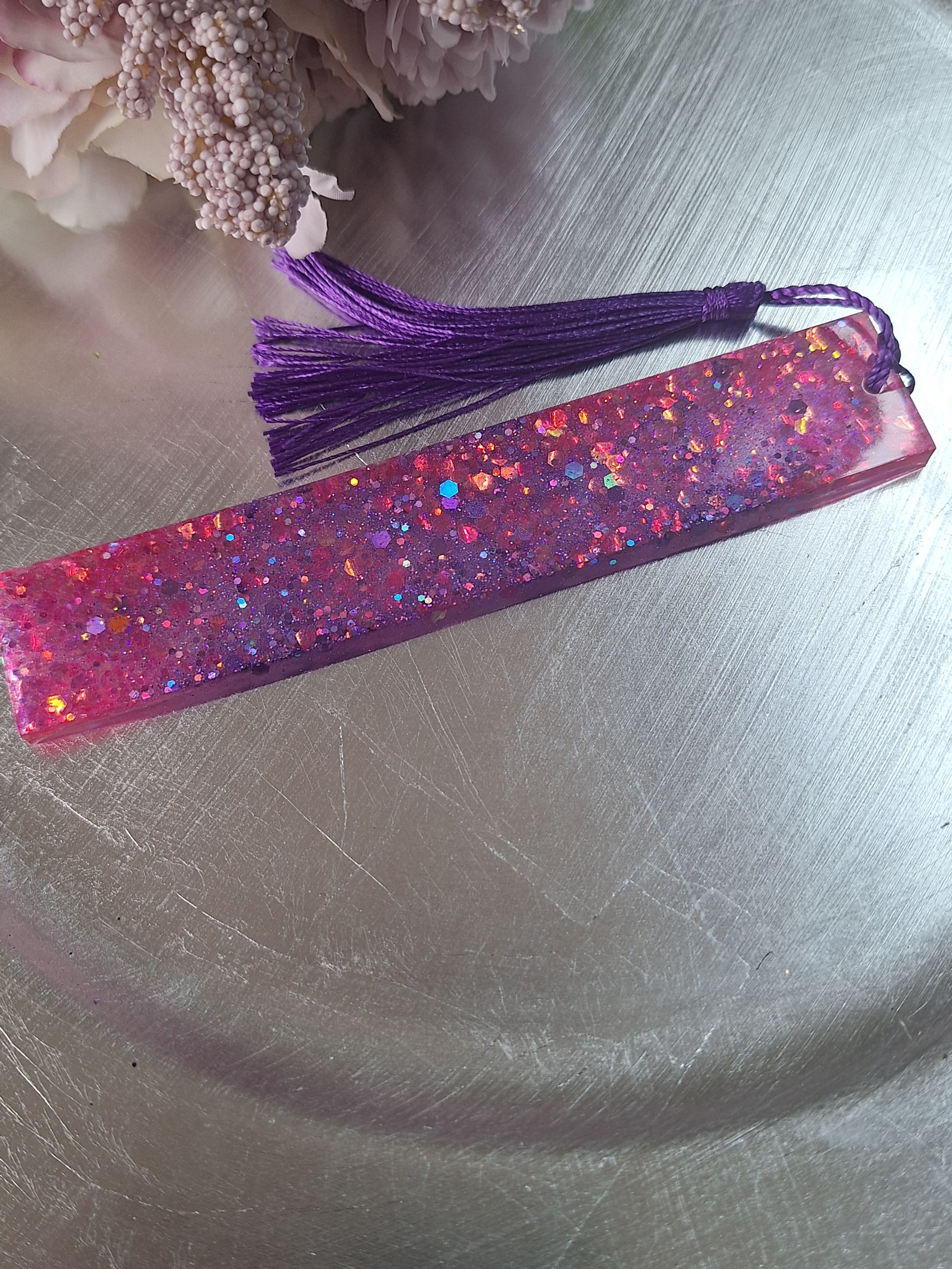 Handmade pink and purple glitter resin bookmark