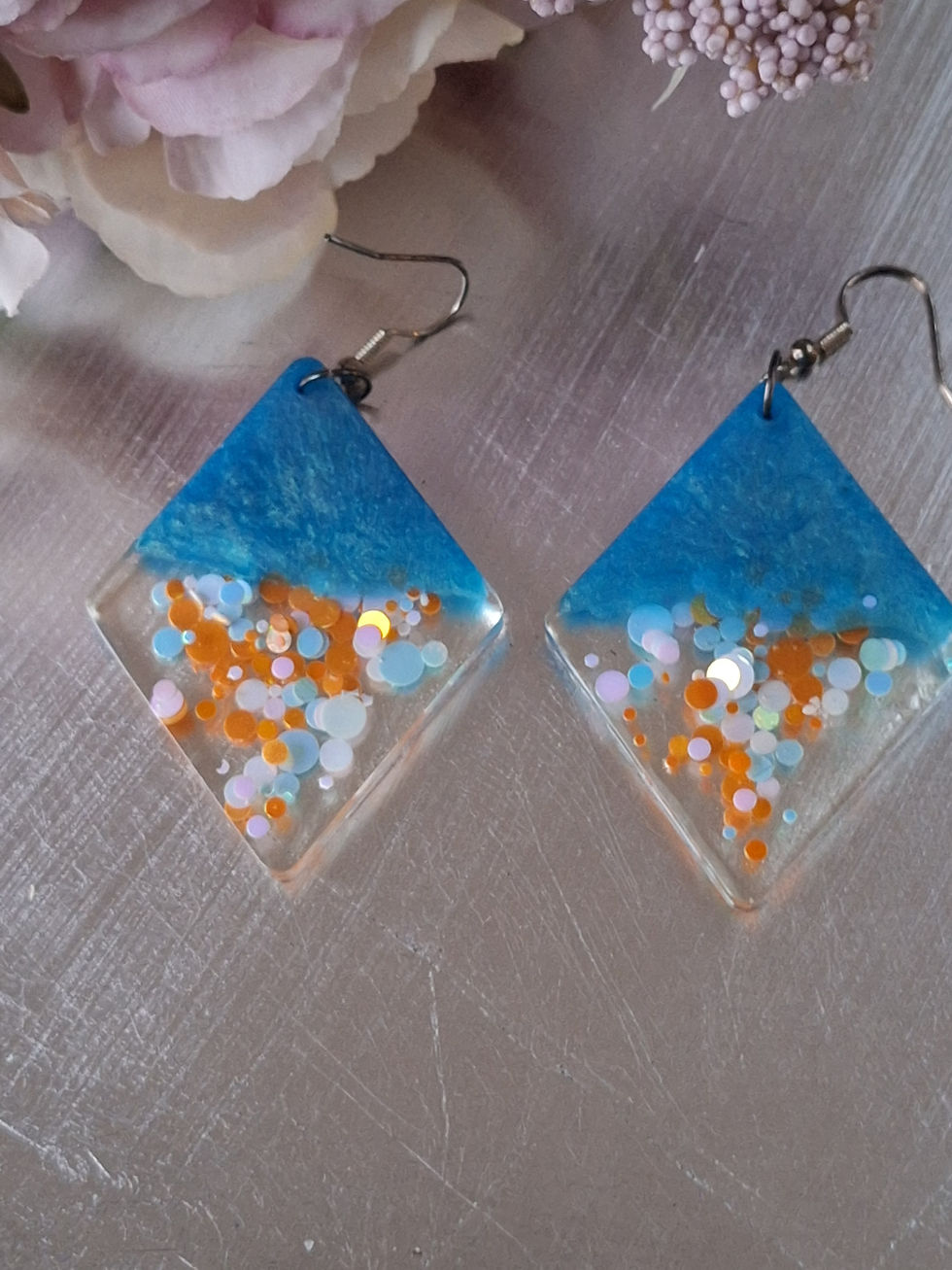 Handmade blue and orange glitter diamond shaped earrings